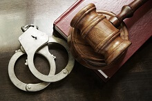 Handcuffs and gavel for homicide crime