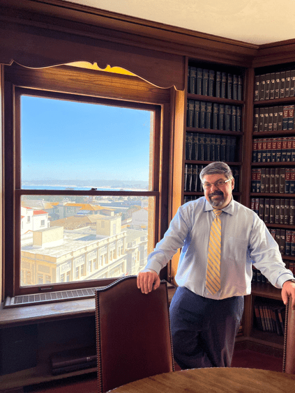 Attorney Pernik standing in the new Monterey office.